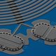 Kotler’s team synchronized the motion of two tiny drums made of aluminum, seen here in a microscope image.